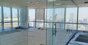 Elegant glass partition wall customized by Glass Aluminum Dubai for office space.
