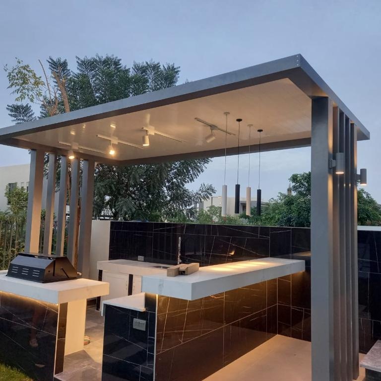 Expert team performing gazebo pergola repair in Dubai residential backyard