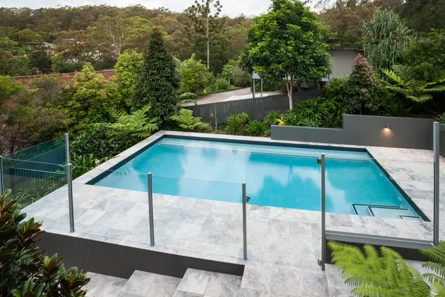 Frameless swimming pool glass fence in Dubai installed at a luxurious residential villa.