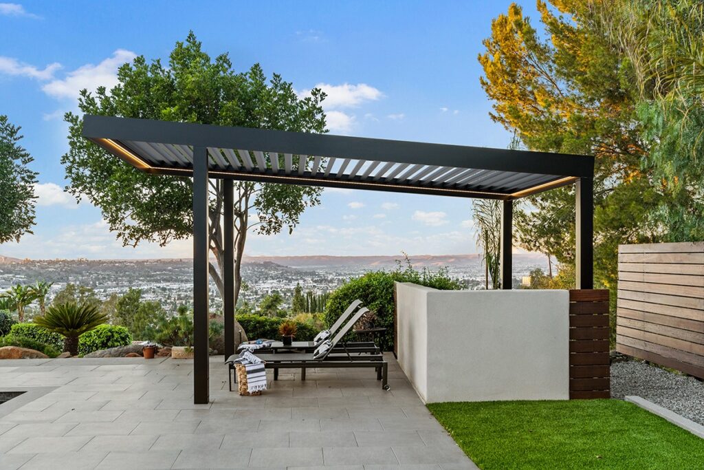Outdoor aluminum pergola with glass panels undergoing expert repair in Dubai