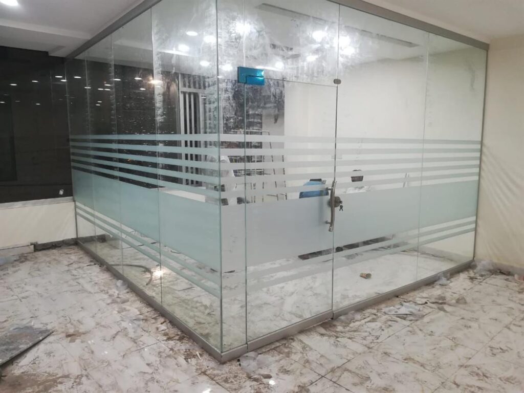 Office glass partition with frosted paper installation in Dubai