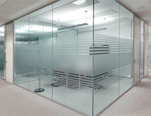 Custom-built office glass partition in Dubai separating workstations elegantly